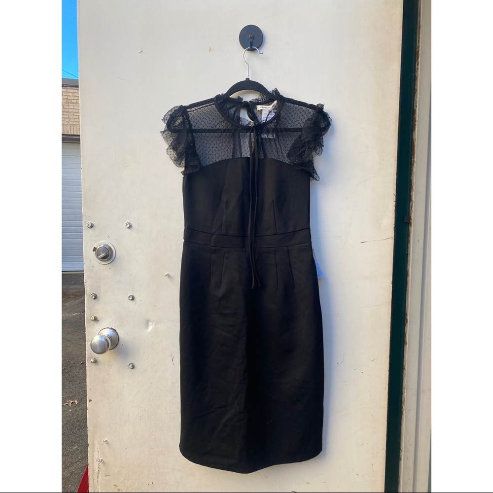 Size small Crimson in Grasse black dress with lacy tie neck.